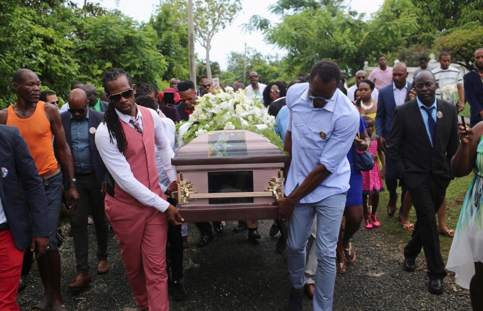 Usain Bolt was close pals with Germaine Mason and helped carry the coffin