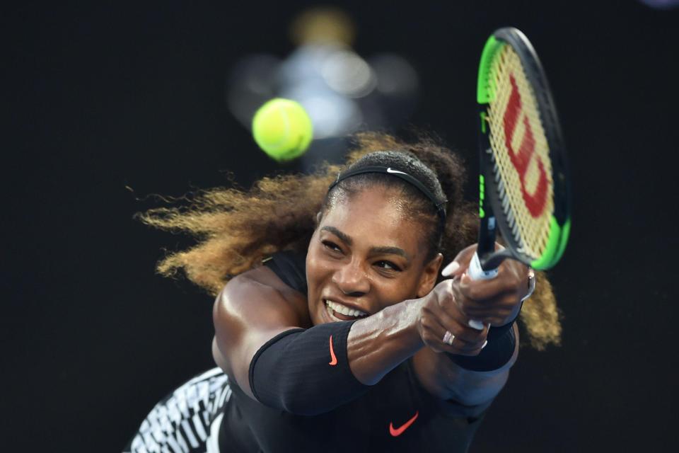  Serena hits a return during the Australian Open in January