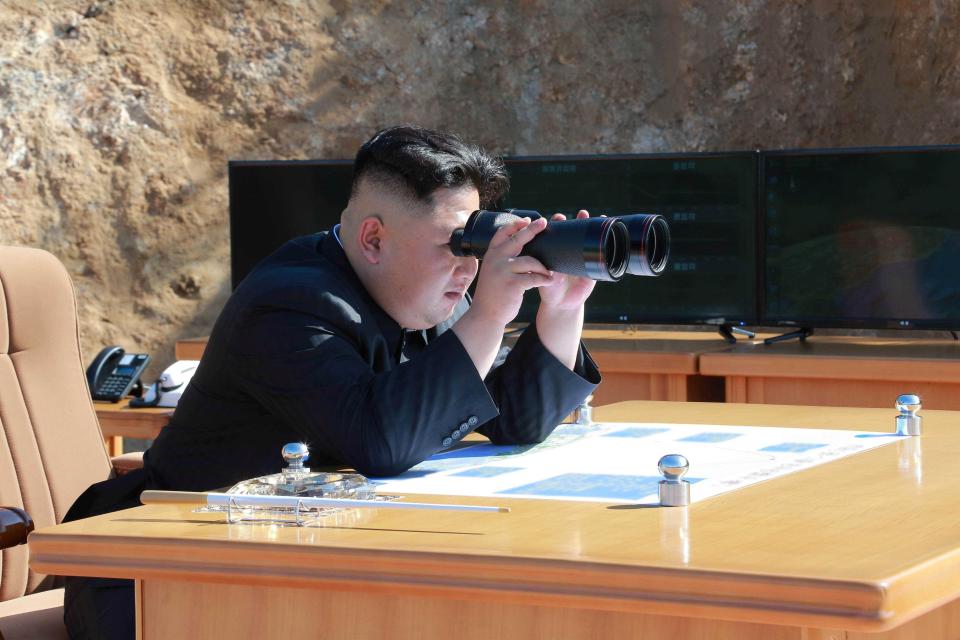  Kim Jong-un pictured at a missile test launch in North Korea as tensions escalate