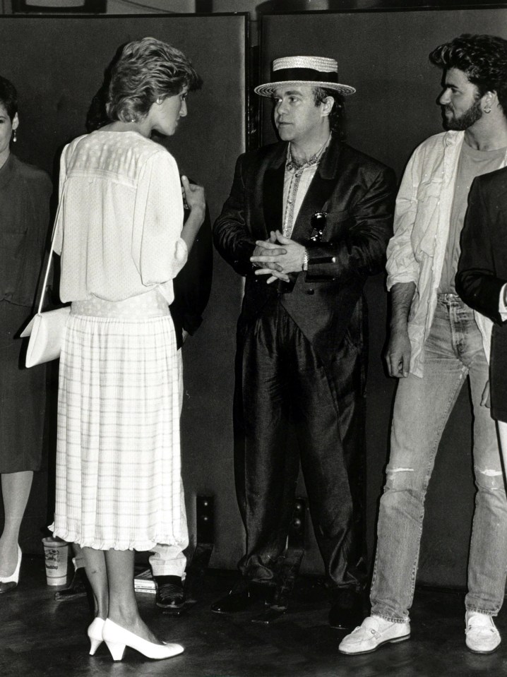 Princess Diana chatting to Elton John and George Michael at the 'Feed the World' Live Aid concert 