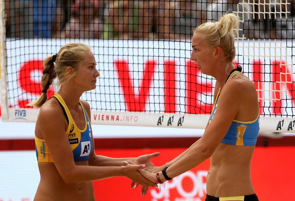  Valentyna Davidova and Ievgeniia Shchypkova of Ukraine celebrate a point against Austria