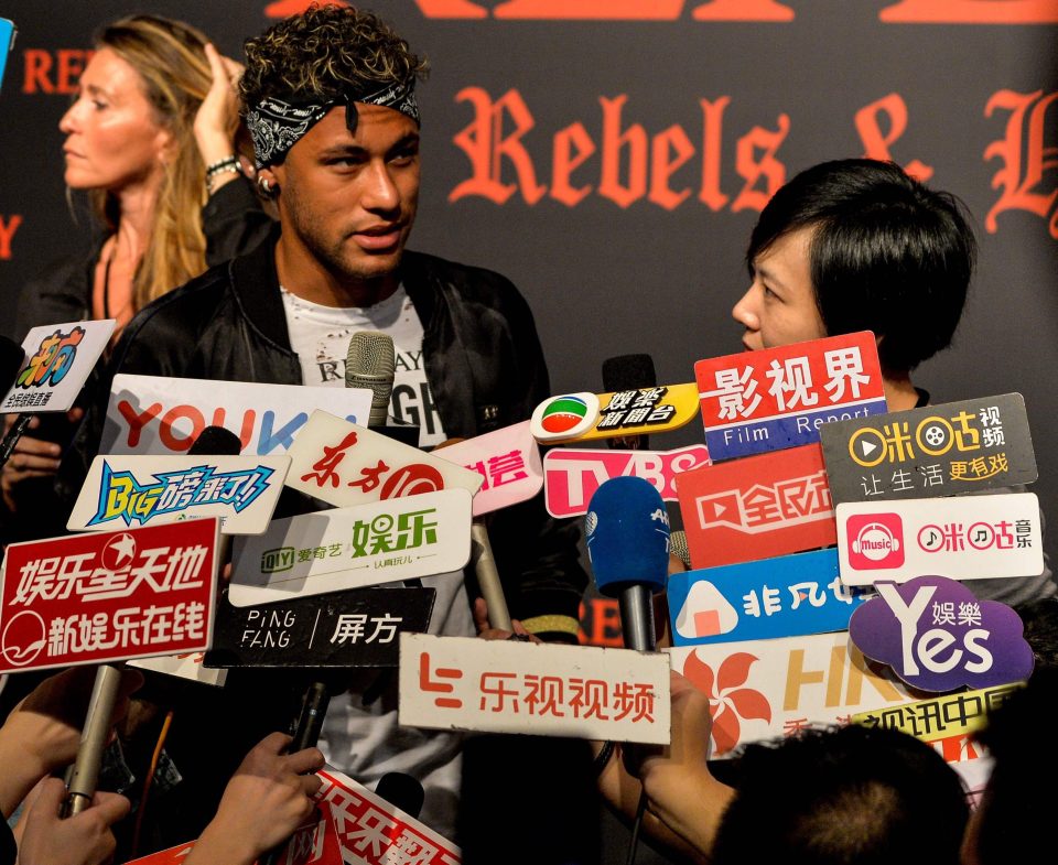 Neymar could hardly escape frenetic media attention at a fashion event in Shanghai