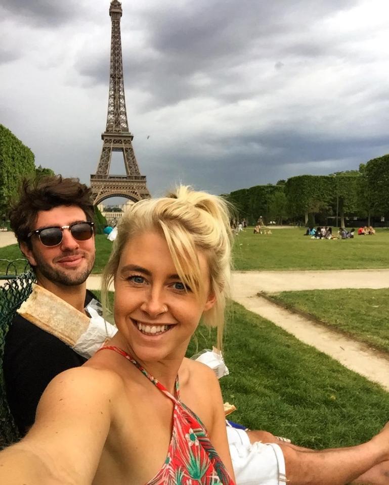  The pair pose for a picture outside the Eiffel Tower in Paris