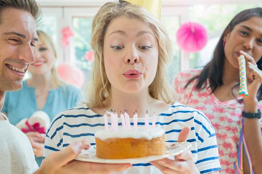 Blowing out your birthday candles results in as much as 15 times more bacteria on the cake than not blowing them out, research has found