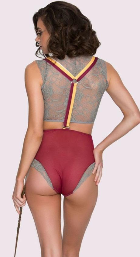  The set includes a lacy top with tie and collar, high-waisted pants and removable suspenders