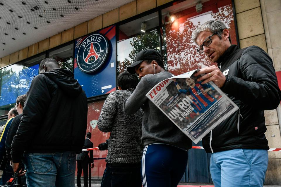 Paris Saint-Germain fans waited outside the PSG store on the Champs Elysees