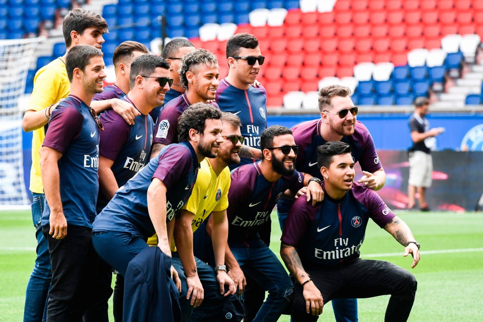 Neymar and his posse of friends and family pose on the Parc des Prices pitch