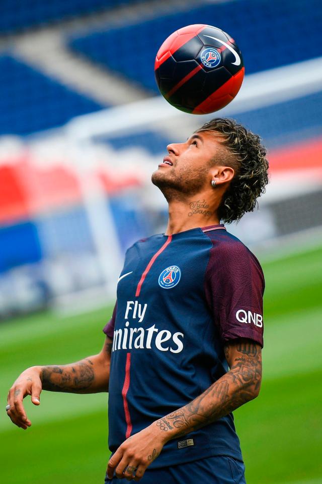 Neymar juggles the ball on his head at Parc des Princes during his unveiling at Paris Saint-Germain