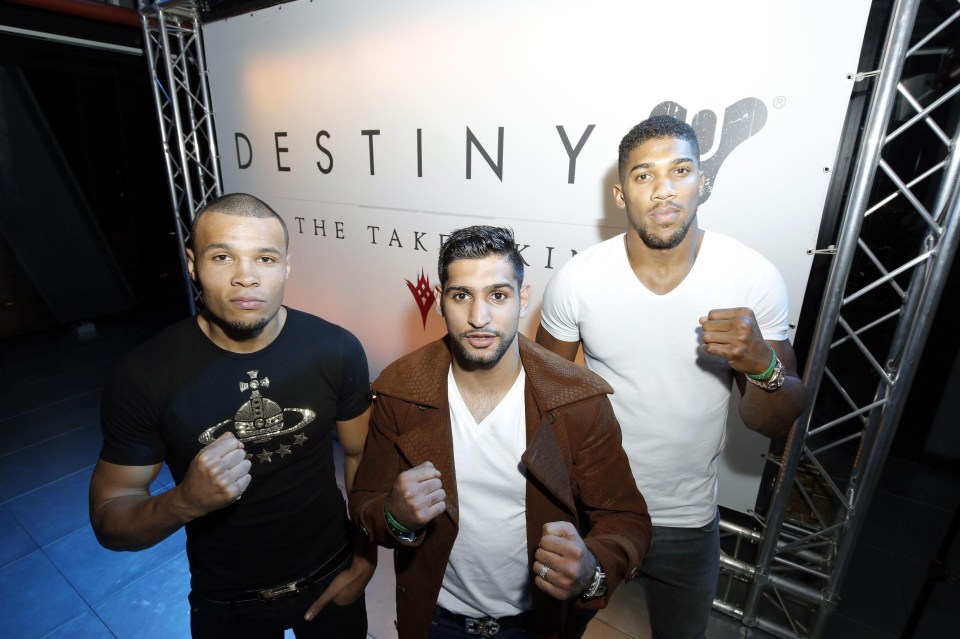 Khan, pictured with Chris Eubank, accused his wife of having an affair with Anthony Joshua (right)