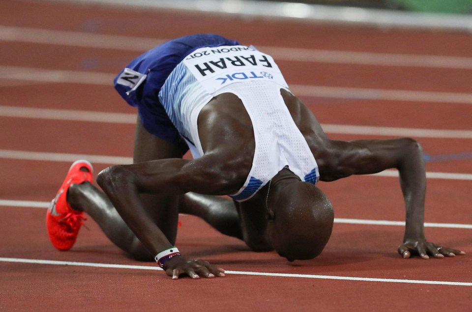 Mo Farah kisses the track at the London Stadium after his 10,000m world title run