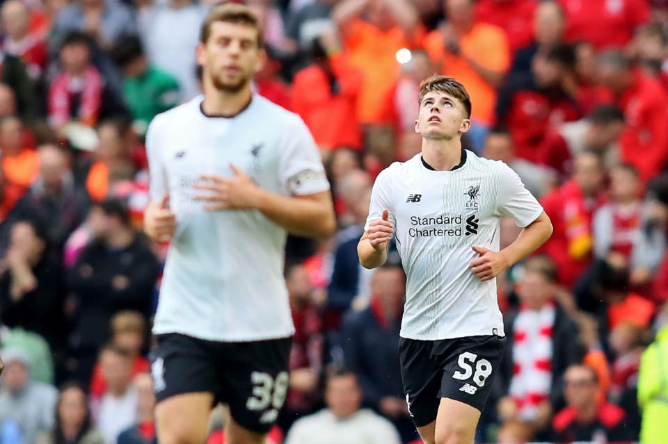  Ben Woodburn (right) celebrated after handing Liverpool the lead again