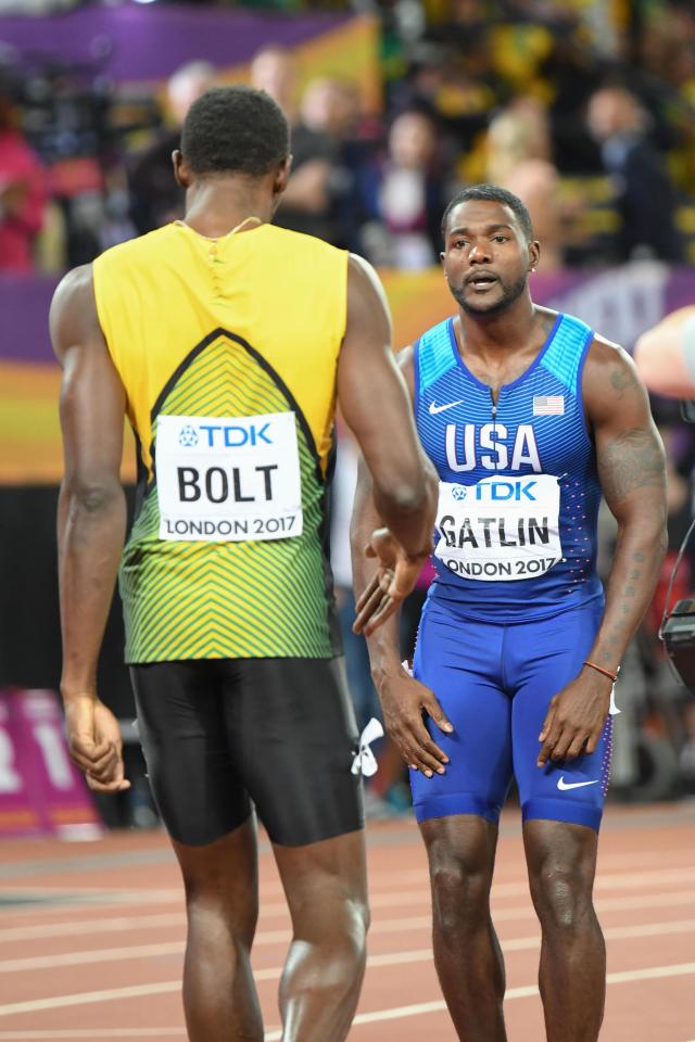 Usain Bolt congratulates justin Gatlin on his victory