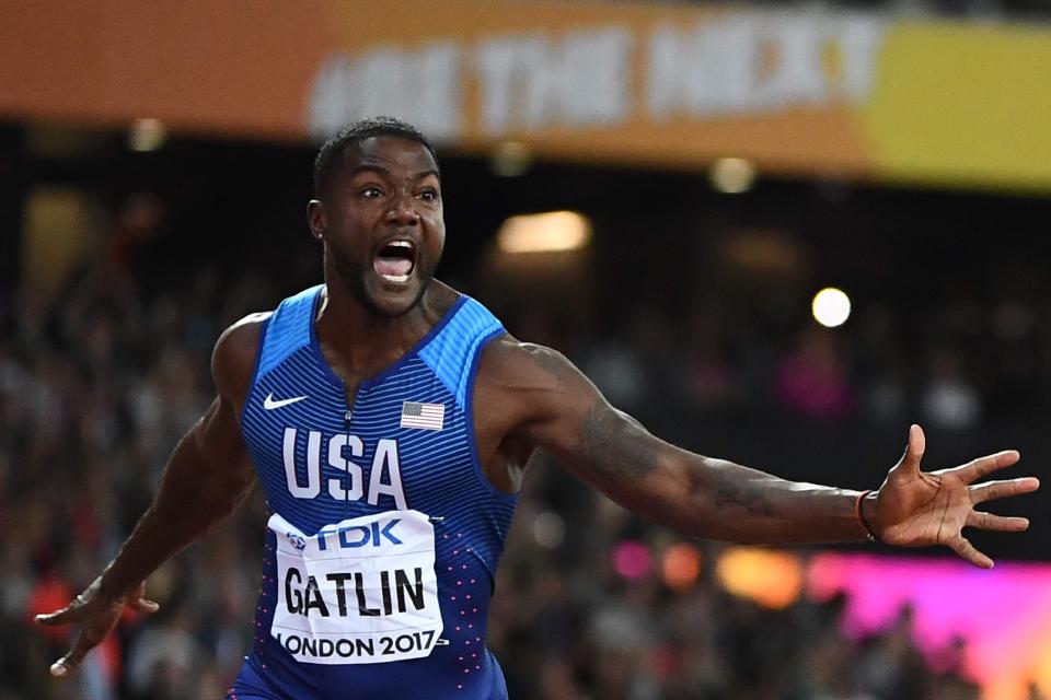 Justin Gatlin celebrates his 100m win but will receive his medal in a half empty stadium