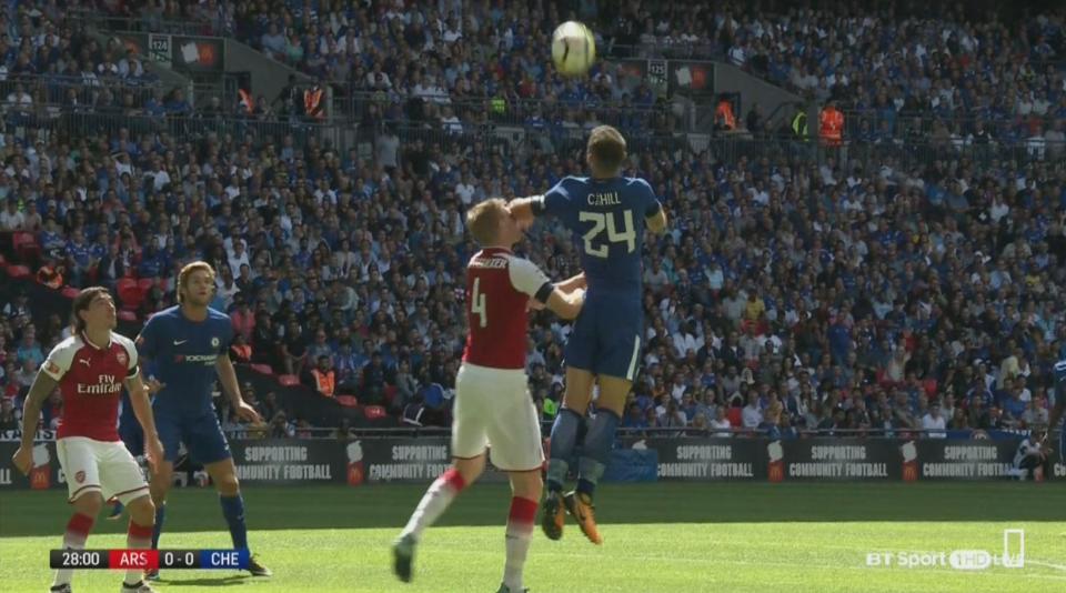  Gary Cahill leaped high above the German defender, but his flailing arm whacked into the face of Mertesacker