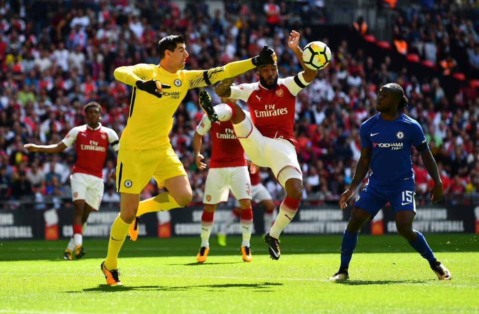 Thibaut Courtois punches the ball clear the during the clash with Arsenal