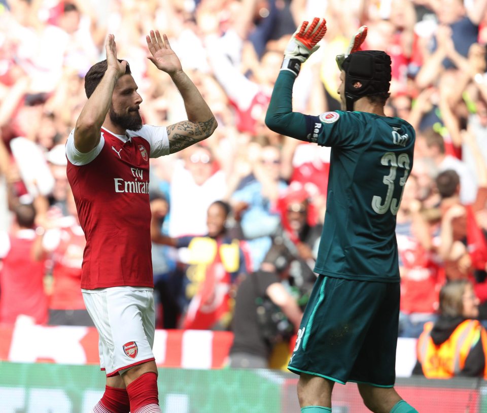 Olivier Giroud celebrates with team-mate Petr Cech after his winning penalty