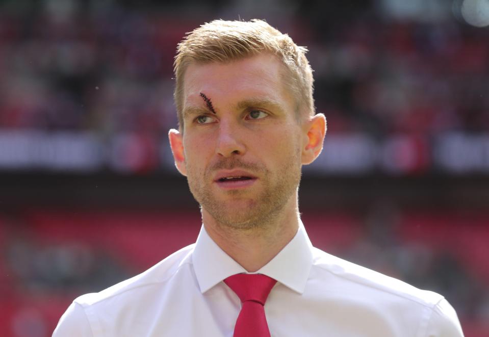  Per Mertesacker has been missing for Arsenal with a hole in his head