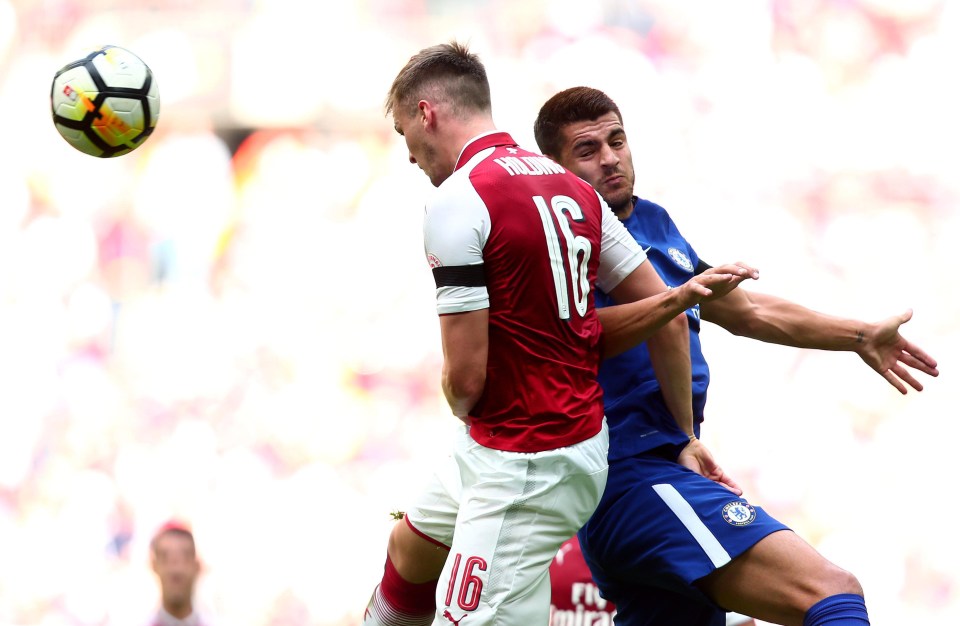 Chelsea new boy Alvaro Morata is beaten in the air by Arsenal defender Rob Holding