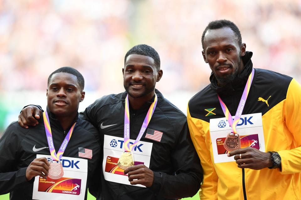 Justin Gatlin savours his gold medal with Christian Coleman and Usain Bolt