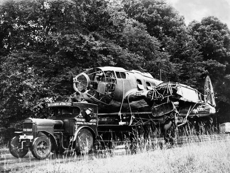  A destroyed plane is towed away after crashing during the fighting