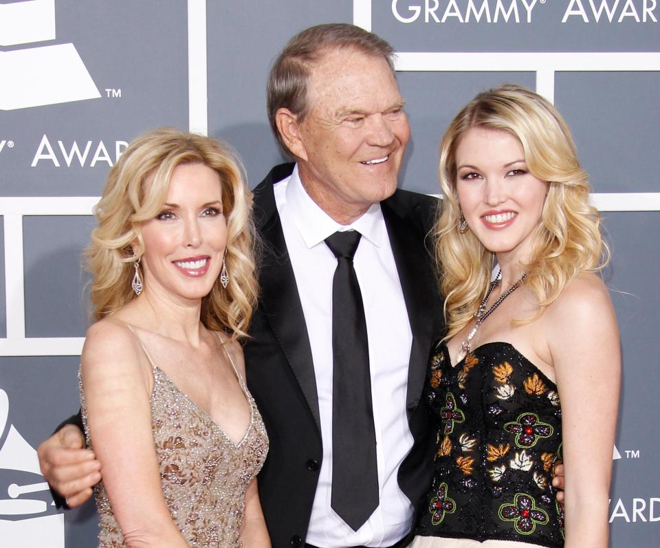  Glen, pictured here with his wife Kim and daughter Ashley, at the Grammy's in 2012