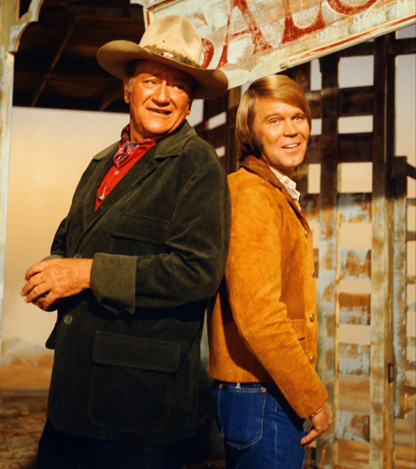  The country singer with John Wayne on the set of True Grit