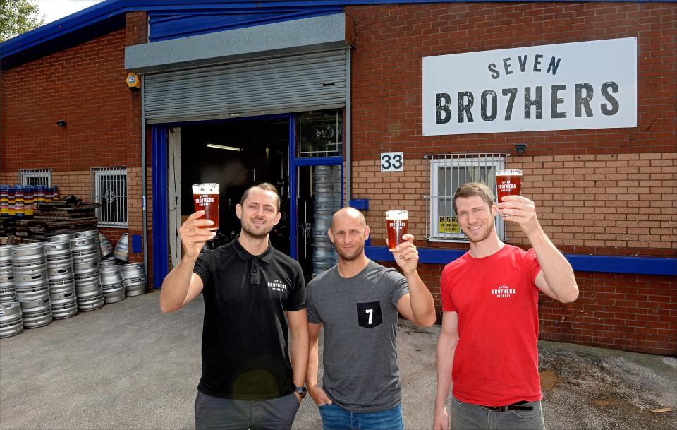  The brothers stand outside the Salford site