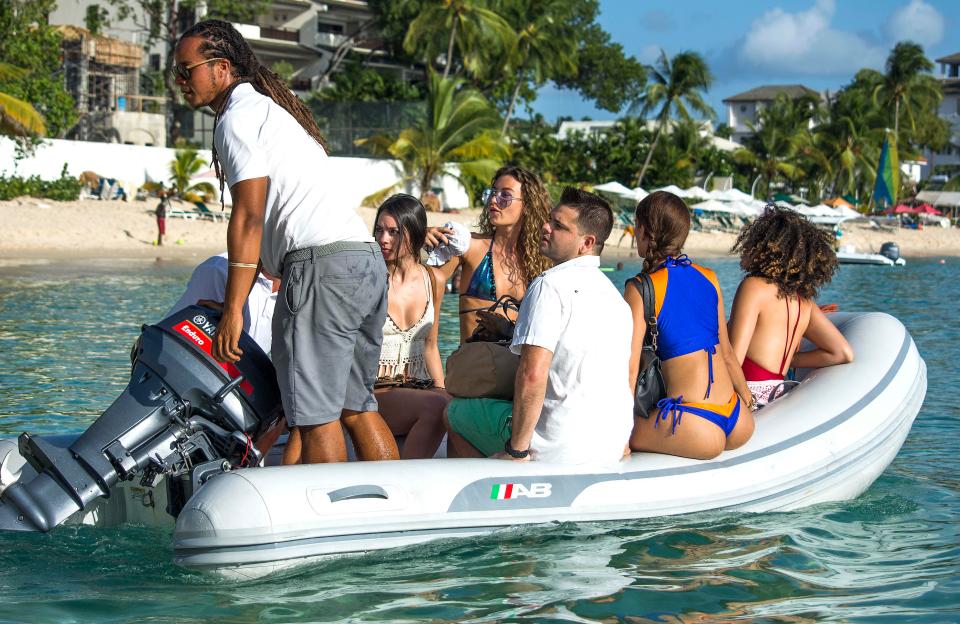  The beach babes were then taken over in a dinghy