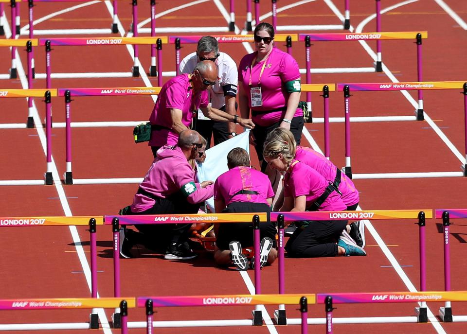 Medics covered Deborah John with a towel to shield her from the crown