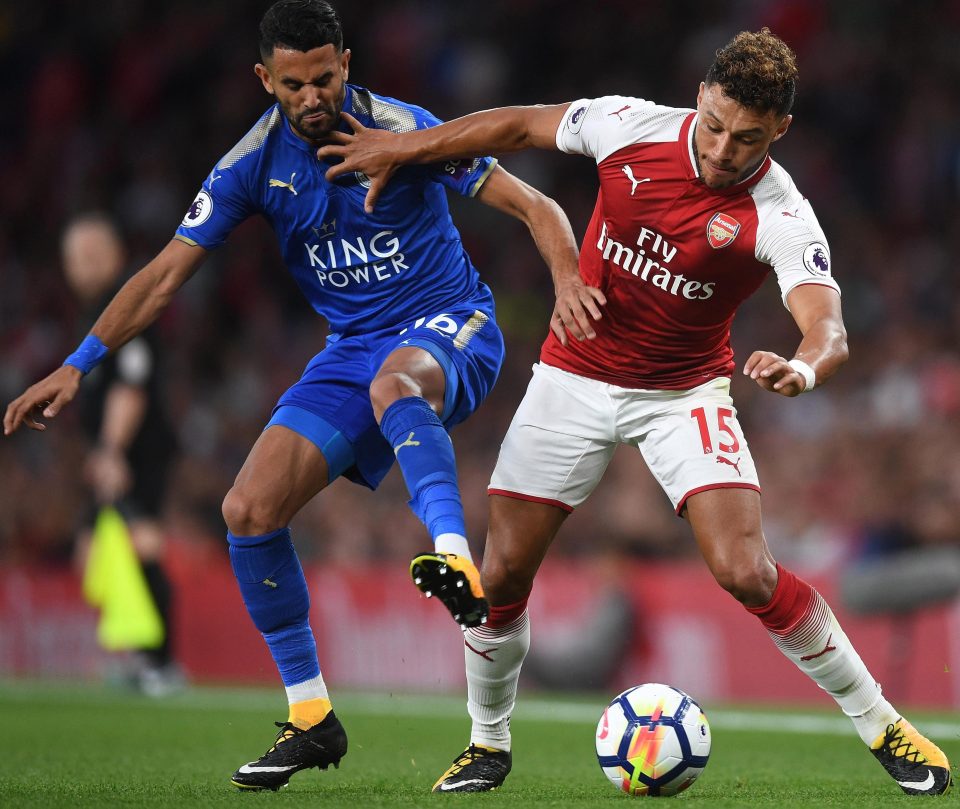 Oxlade-Chamberlain battles for possession with Leicesters Riyad Mhrez