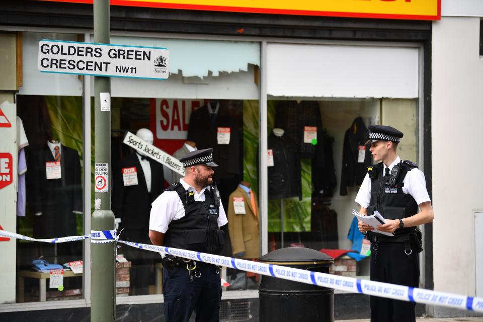  Cops stand at the cordon where enquiries are ongoing following the fatal stabbings in August last year