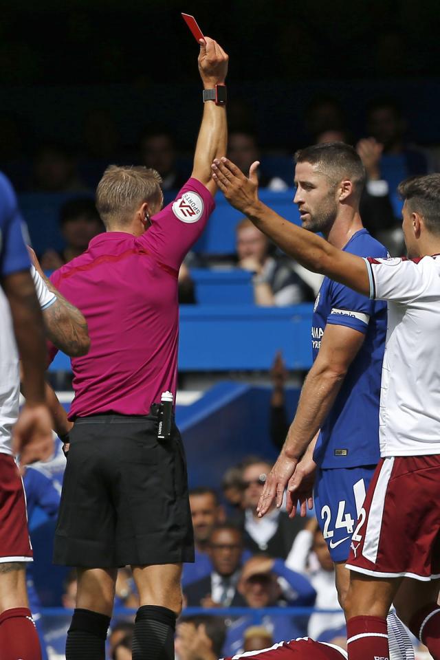 Gary Cahill saw red for a bad foul on Steven Defour after just 14 minutes