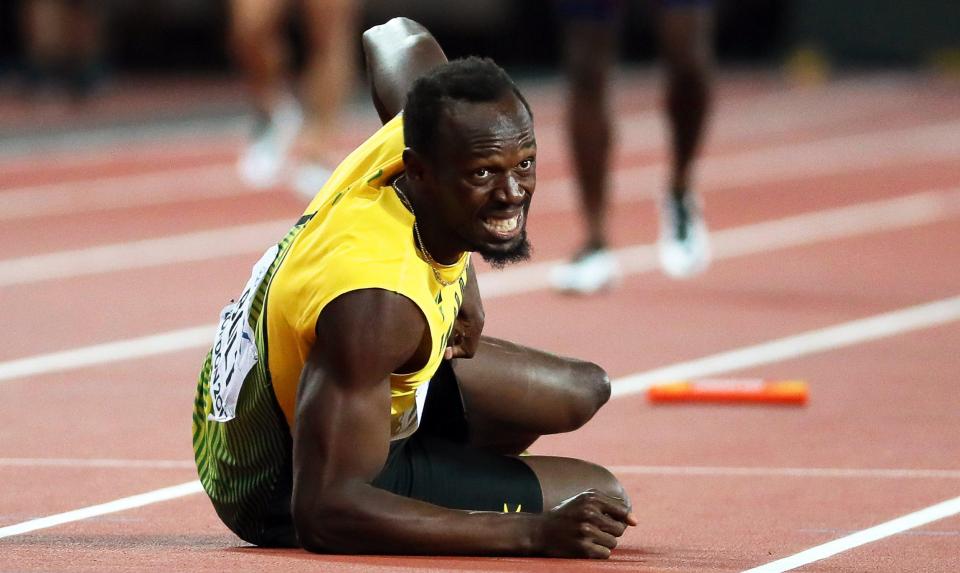  Usain Bolt hit the deck in agony during the World Athletics Championships