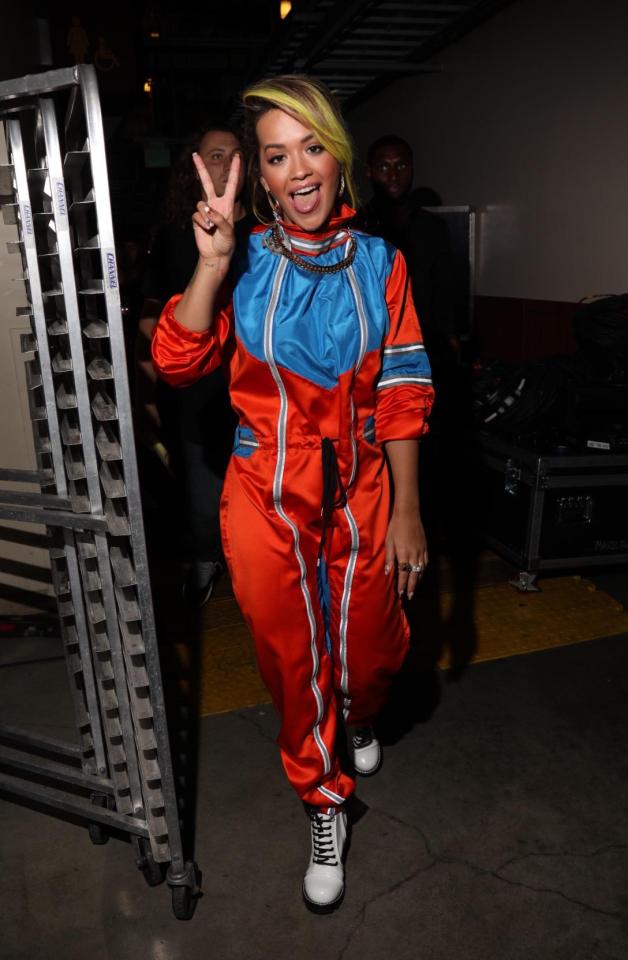  She later changed into a red and blue race-car driver style jumpsuit for her performance