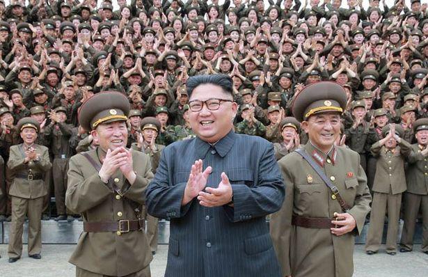  The despot pictured with his fanatical troops as his war of words with the US continues