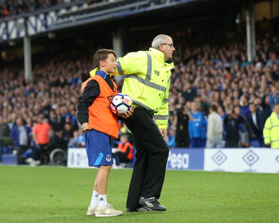 Stewards ushered the ball-boy to safety after van violence erupted