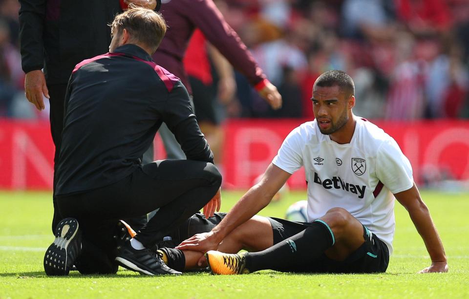 Winston Reid slumps on the floor after injuring himself in the warm-up at Southampton