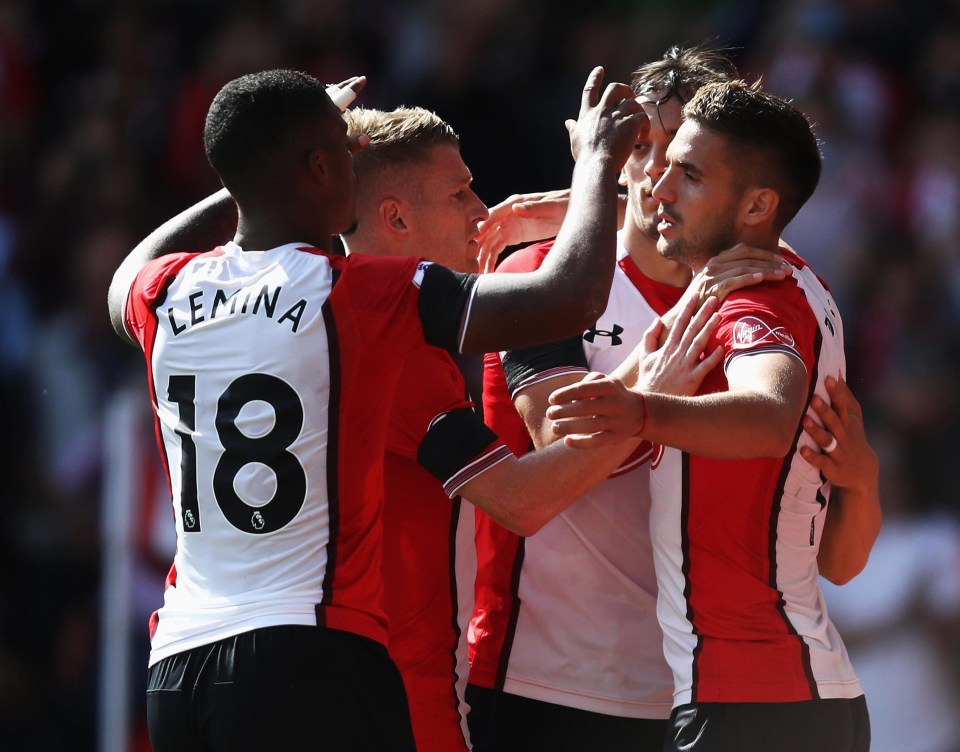 Dusan Tadic is mobbed by his Southampton team-mates after doubling the lead