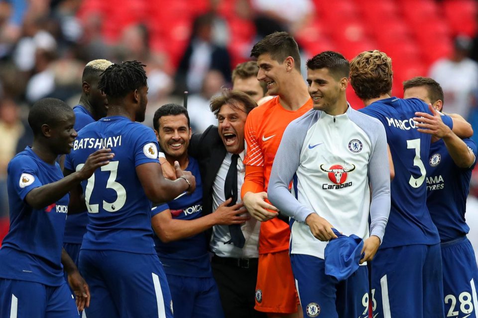 Antonio Conte celebrates with his Chelsea players after victory over Tottenham