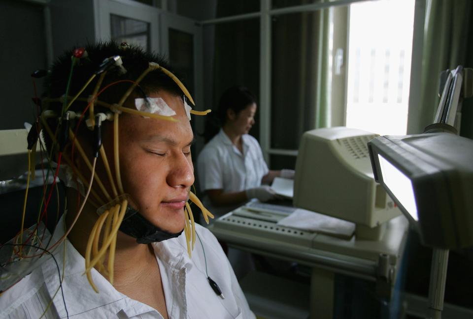  Another patient receives his electroencephalogram check - this time at the Beijing Military Region Central Hospital