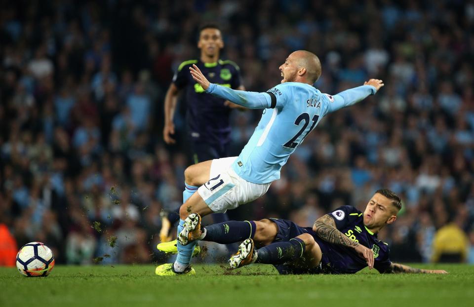 Muhamed Besic puts in a crunching challenge on David Silva at the Etihad