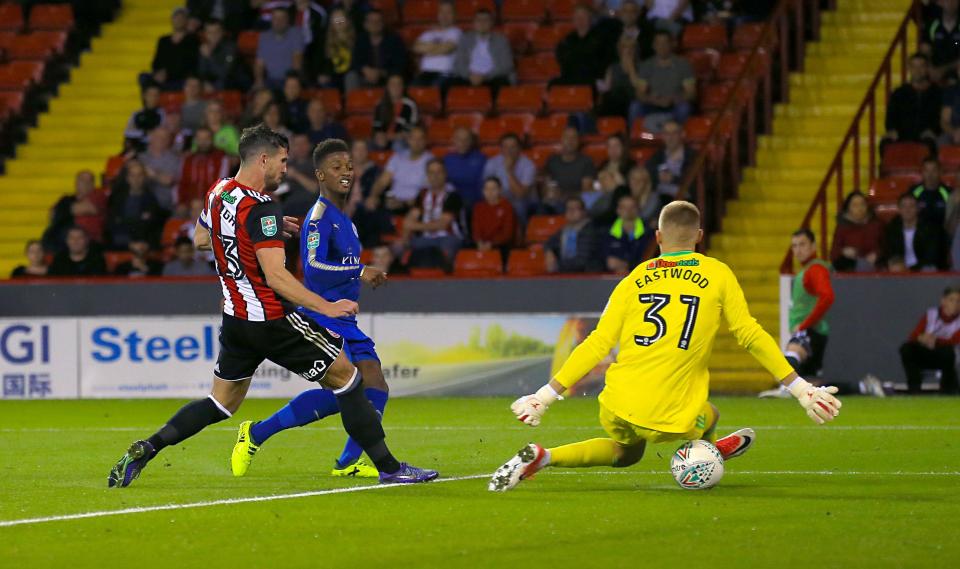 Demarai Gray slides Leicester in front after the break