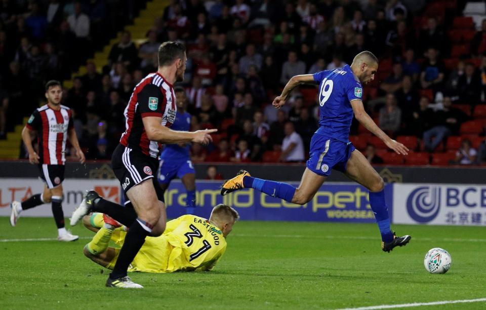 Islam Slimani rounds the keeper to score Leicester's second