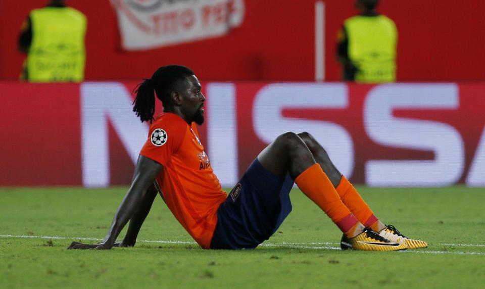  Emmanuel Adebayor looks despondent after coming agonisingly close to knocking Sevilla out of the Champions League