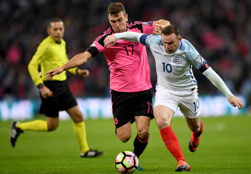  Wayne Rooney in his 119th and final England appearance, taking on Scotland