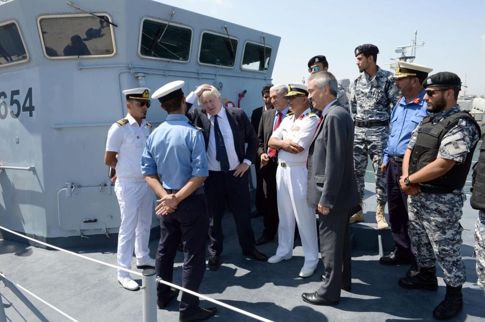  Mr Johnson on board a Libyan boat discussing efforts to ease the migrant crisis