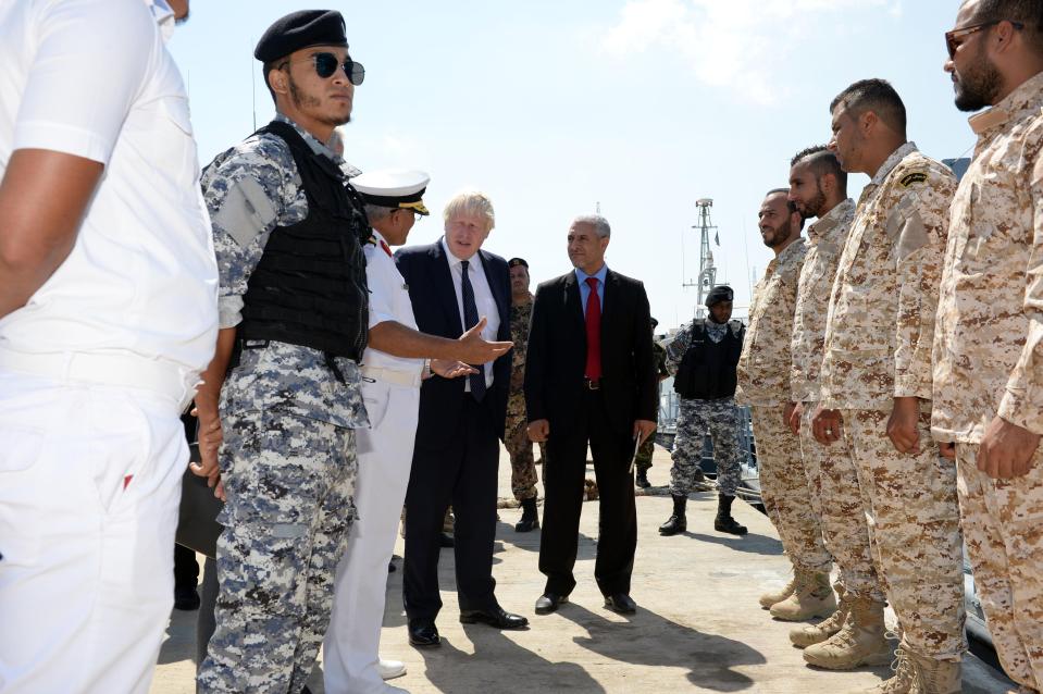  The Foreign Secretary inspected troops with Libyan officials during his trip