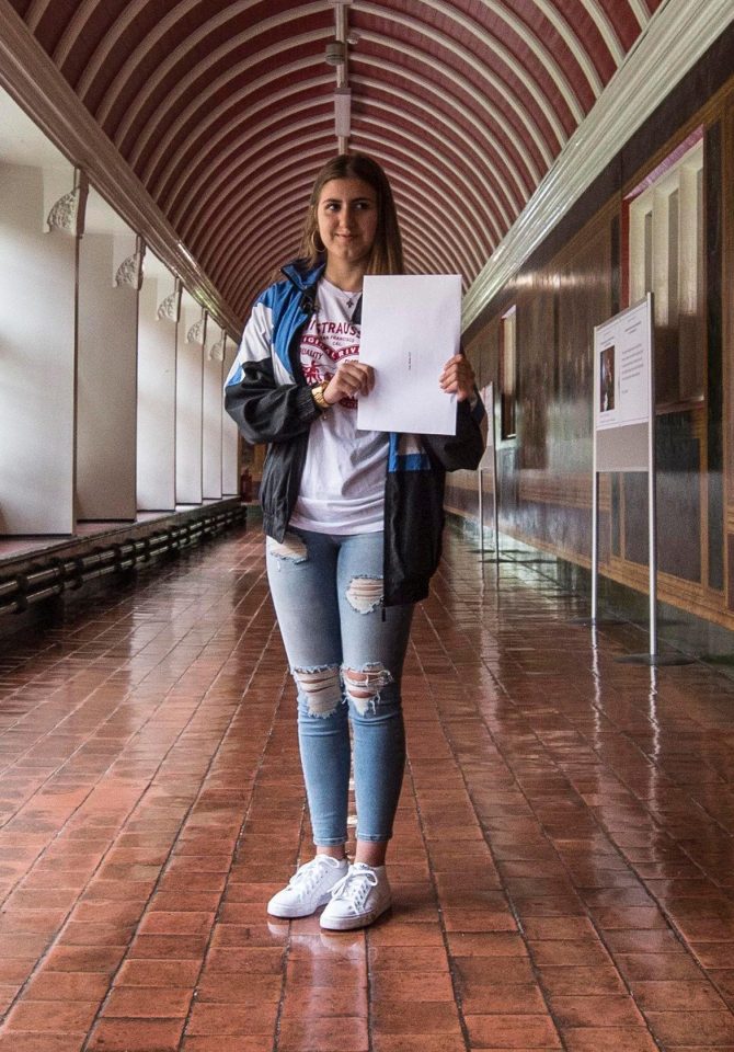  Ines proudly holds up her GCSE results two months on from the devastating inferno