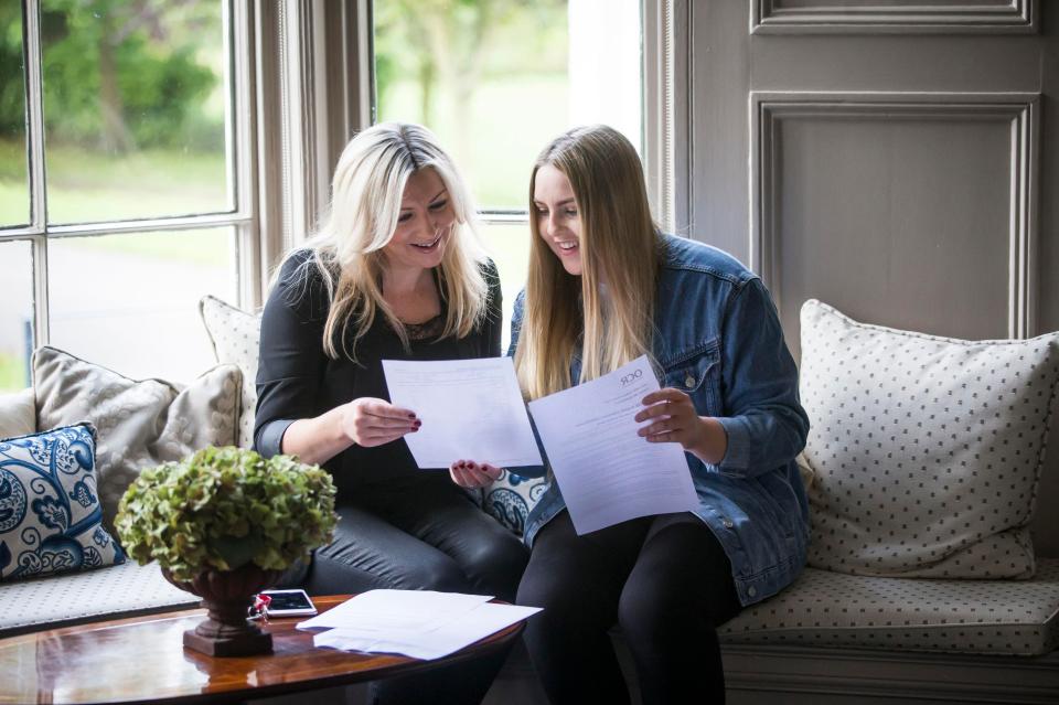  Pupil Holly Blake from the Mount School, York shows her results to her mother