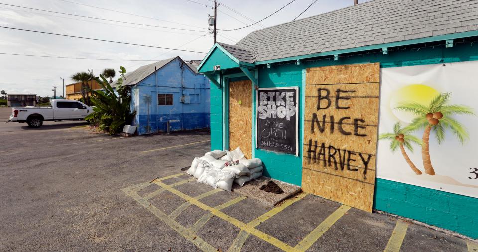  Residents boarded up shops and homes as they pleaded with the storm to 'be nice'